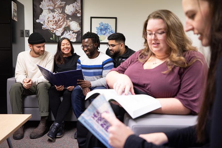 A group of students relax in a lounge