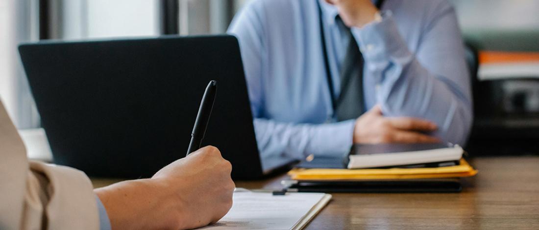 A person interviewing a potential job candidate.